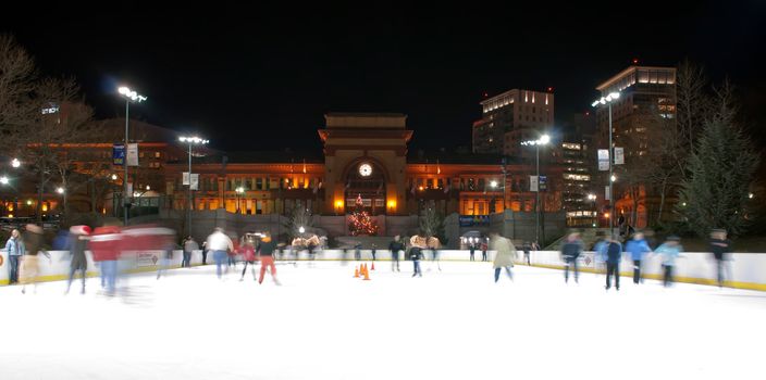 providence on a cold december evening with people ice skating