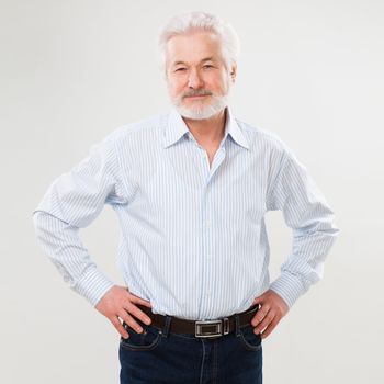 Handsome elderly man with beard isolated over white background