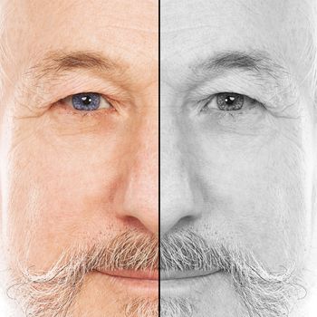 Portrait of handsome elderly man with beard on a white background