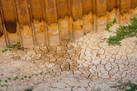 Dried soil cracked texture in site construction.