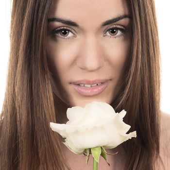 Portrait of beautiful woman with white rose on white background