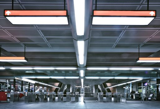 Here is a Montreal metro entrance and gate. This is where you have to pay you tickets to access to the metro platform. there is sign which the title have been removed so you can add whatever you want instead. All logos have been removed. this is a real underground scene.