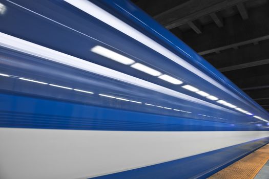 Just a close shot and almost abstract of a metro passing by. Long exposure and no people in the shot. This image create some nice white stripes !