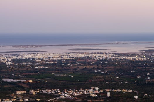 Wide view of the area of Faro city, located on the Algarve, Portugal at sunset.