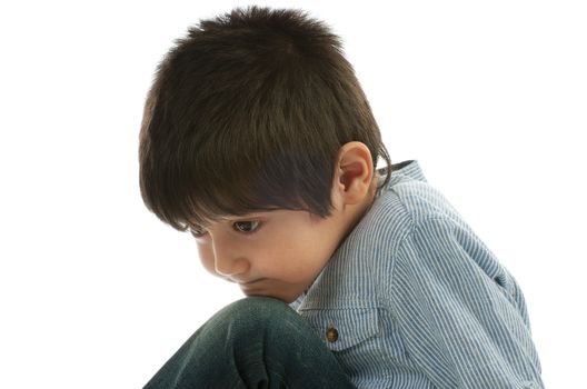 Sad Little Boy in Striped Shirt closeup on white background