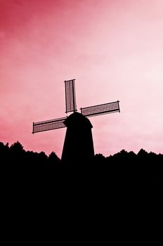 silhouette Wind generator on colorful sky