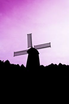 silhouette Wind generator on colorful sky