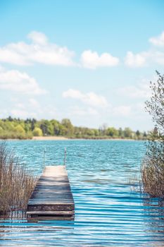 Bathing jetty for relaxing in light, green nature at Chiemsee, Germany