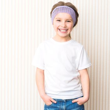 Cute smiling little girl in white t-shirt