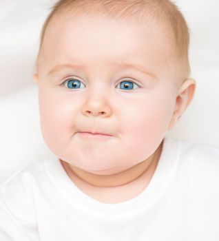 Funny closeup portrait of smiling adorable baby