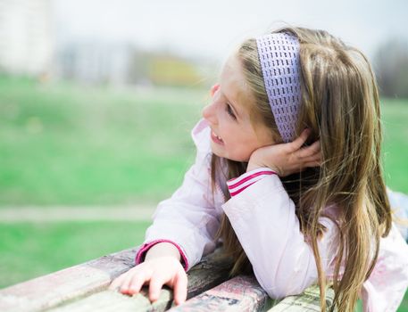 pretty smilling liitle girl in park