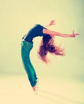 young and beautiful dancer posing in studio