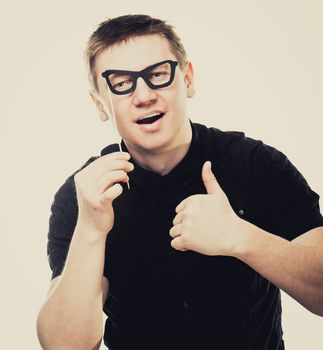 funny man with fake glasses thumbs up