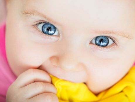 bright closeup portrait of funny adorable baby