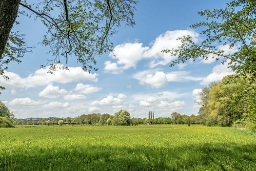 Meadows with clouds and sun in Chiemgau, Germany