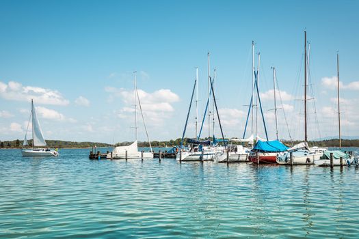 Sport sailboat on the Lake Chiemsee with bright sun