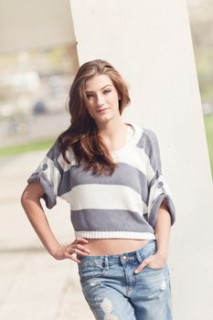 attractive young brunette woman barefoot in summertime outdoor