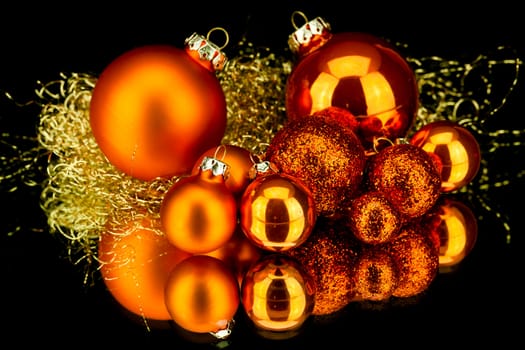 christmas decoration in orange and gold on black background