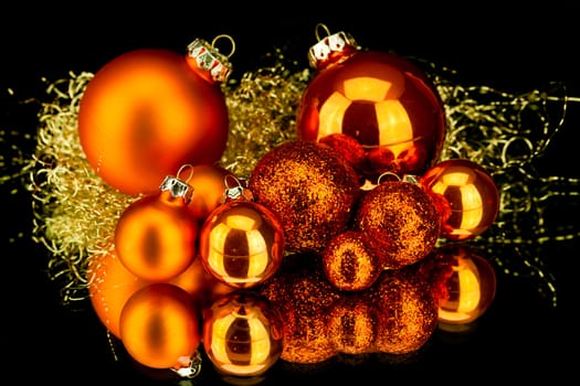 christmas decoration in orange and gold on black background