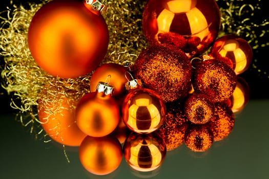 christmas decoration in orange and gold on black background