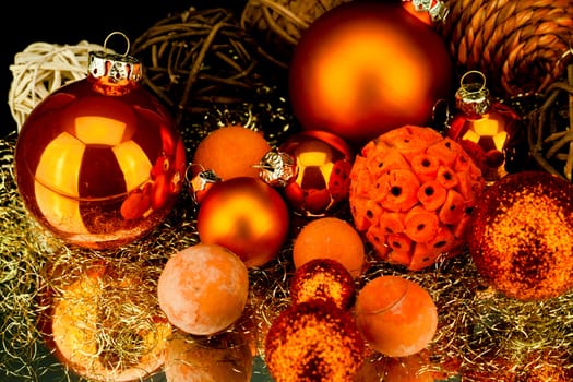 christmas decoration in orange and gold on black background
