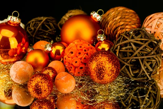 christmas decoration in orange and gold on black background