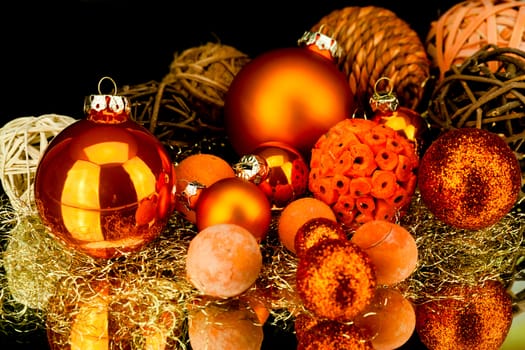 christmas decoration in orange and gold on black background