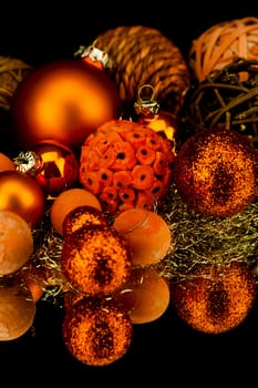 christmas decoration in orange and gold on black background
