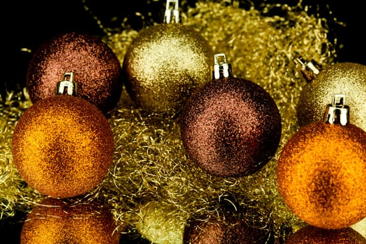 christmas decoration in orange and gold on black background