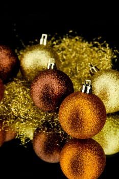 christmas decoration in orange and gold on black background