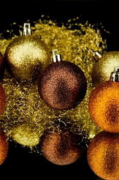 christmas decoration in orange and gold on black background