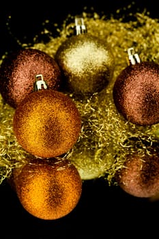 christmas decoration in orange and gold on black background