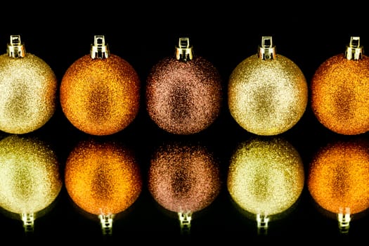 christmas decoration in orange and gold on black background