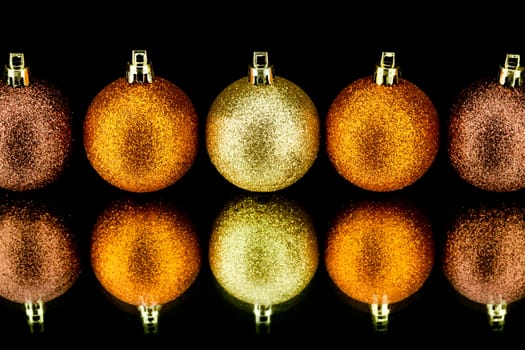 christmas decoration in orange and gold on black background