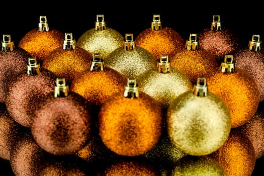 christmas decoration in orange and gold on black background