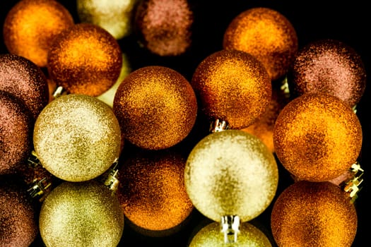 christmas decoration in orange and gold on black background