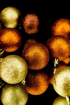 christmas decoration in orange and gold on black background