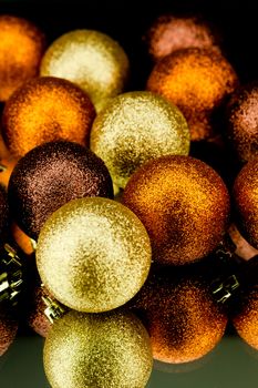 christmas decoration in orange and gold on black background