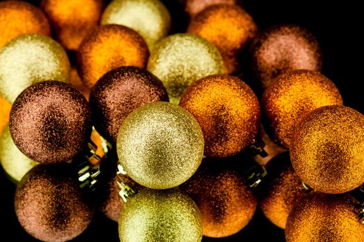 christmas decoration in orange and gold on black background