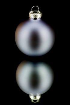 christmas decoration bauble in blue on black backround