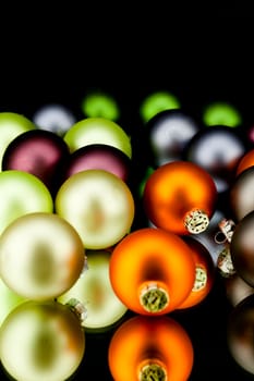 christmas decoration in gold lime green and mixed colours isolated on black background