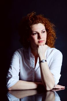 attractive young redhead woman emotion portrait ob black 