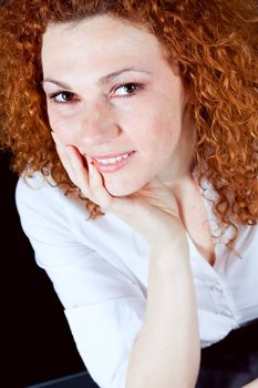 attractive young redhead woman emotion portrait ob black 
