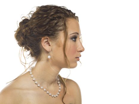 A young woman wearing a pearl necklace with matching earrings.                                        Makeup By: Wright Artistry www.wrightartistry.com