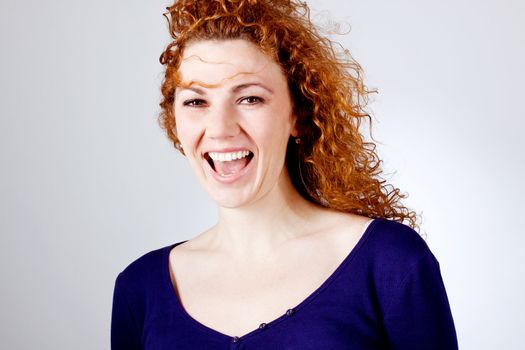 attractive young redhead woman smiling laughing emotion portrait