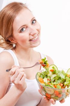 attractive young woman eating fresh healthy salad for lunch