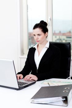 young successful business woman working on computer in office