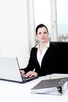 young successful business woman working on computer in office