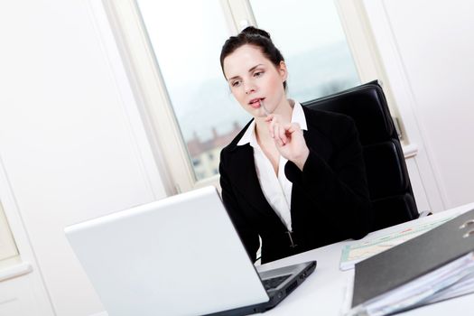 young successful business woman working on computer in office