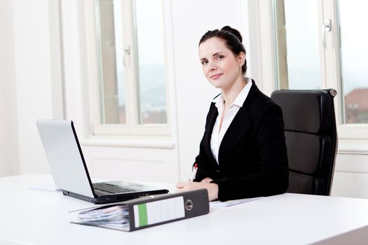 young successful business woman working on computer in office